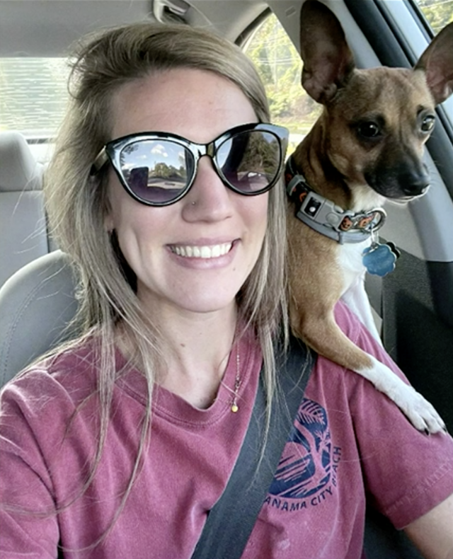 Nurse driving home with dog